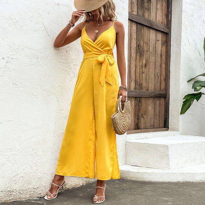 Leuchtend gelber Jumpsuit von Andrea Serena mit Bindebändern